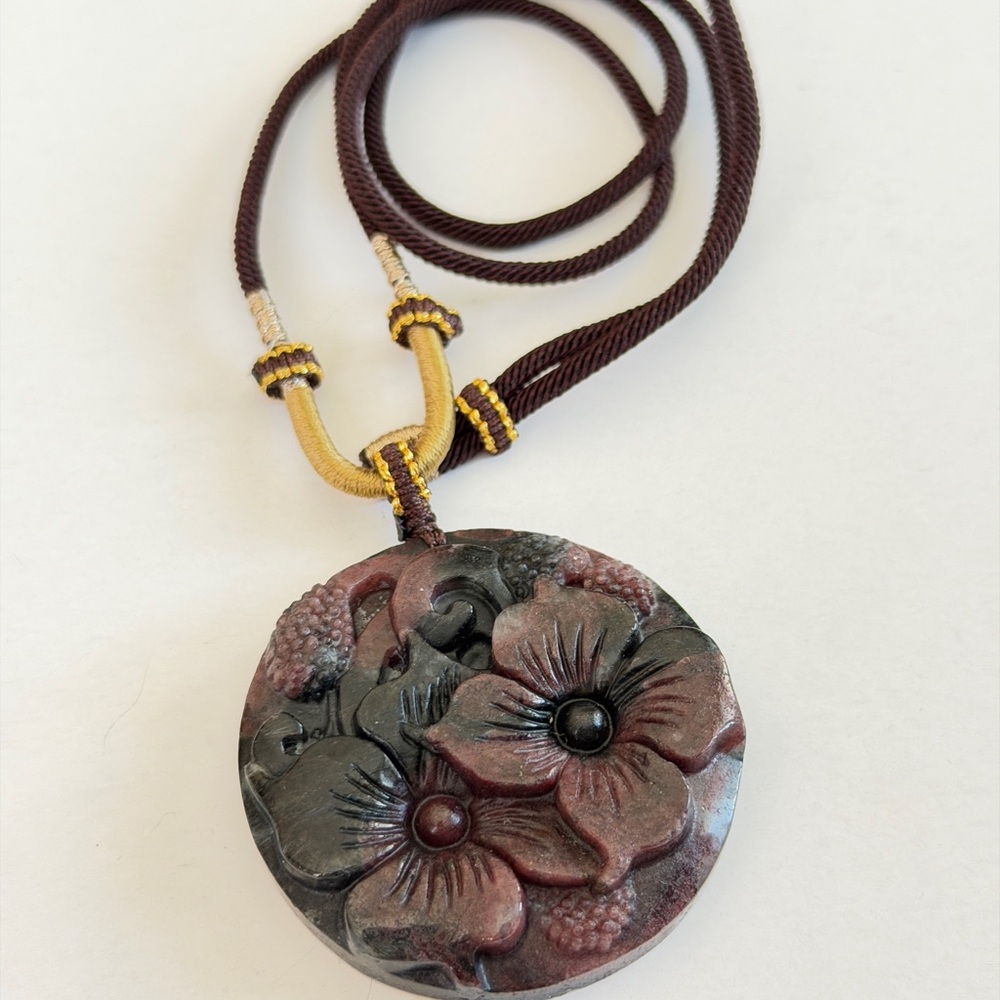 Garnet with Astrophyllite Flowers Pendant with Necklace Cord
Natural Crystal